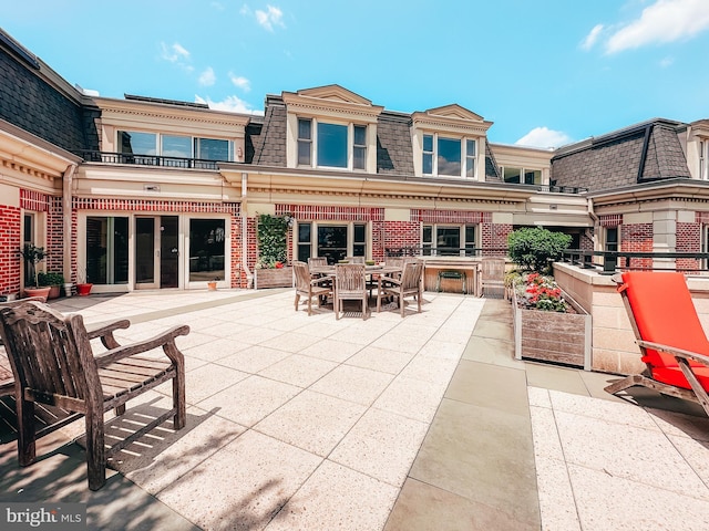 rear view of house with a patio