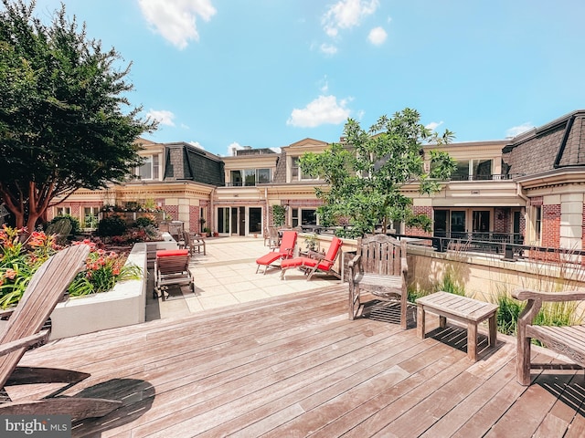 wooden terrace featuring a patio area