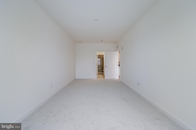 empty room featuring light colored carpet