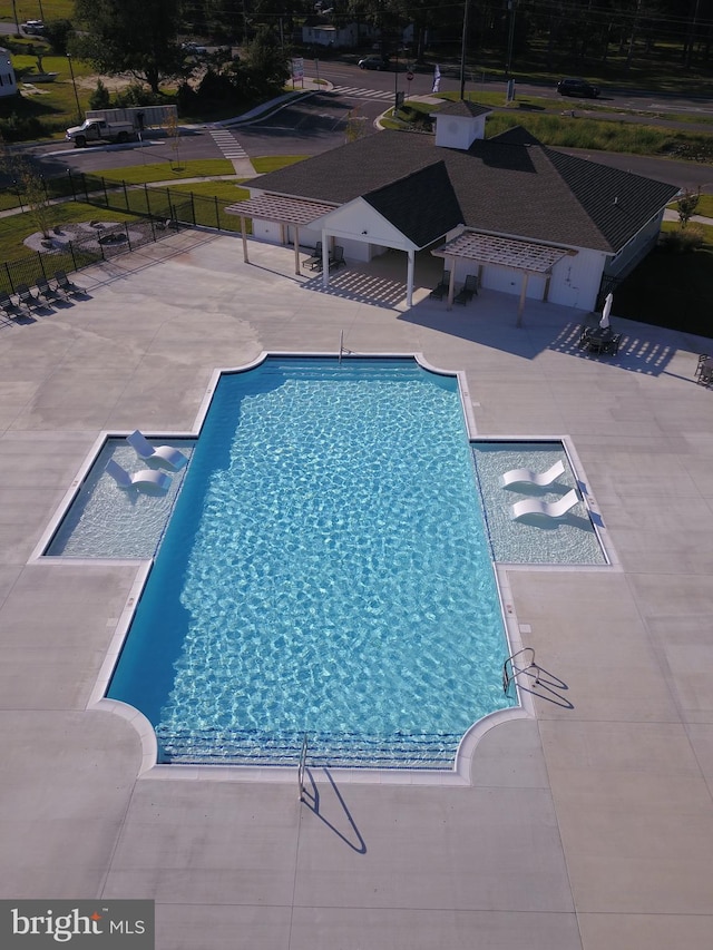 view of swimming pool featuring a patio area