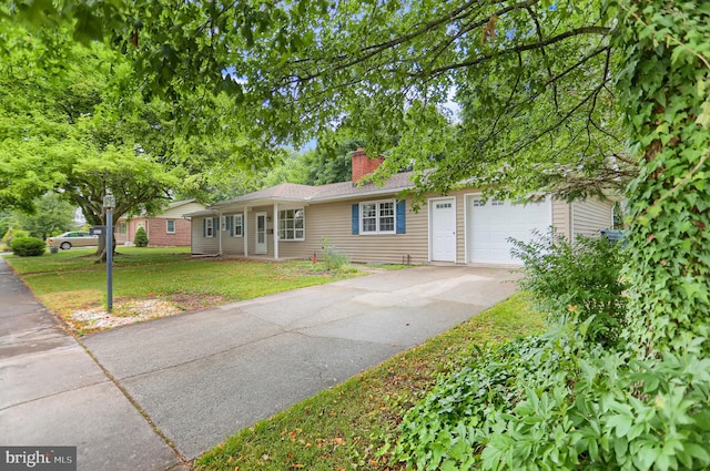 single story home with a front lawn and a garage