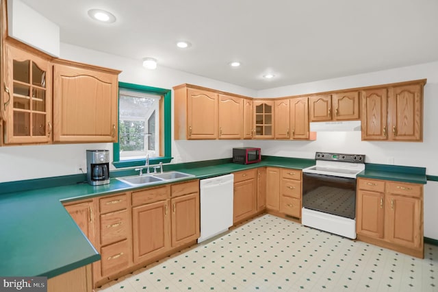 kitchen with white appliances, sink, and light tile floors