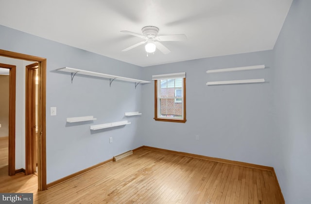 unfurnished room featuring ceiling fan and light wood-type flooring