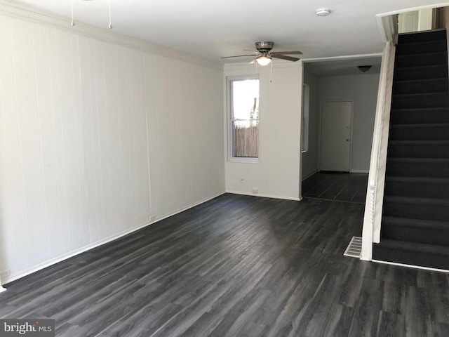 unfurnished room with ornamental molding, ceiling fan, and dark hardwood / wood-style floors