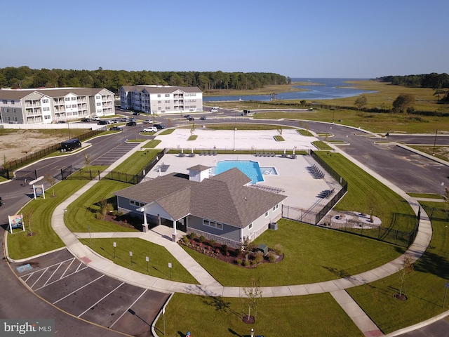 birds eye view of property featuring a water view