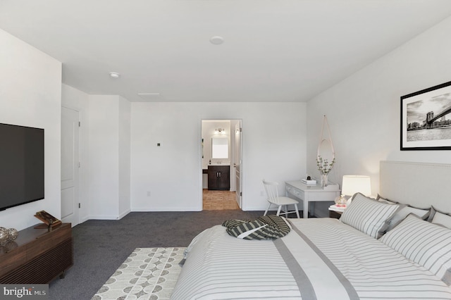 carpeted bedroom featuring connected bathroom