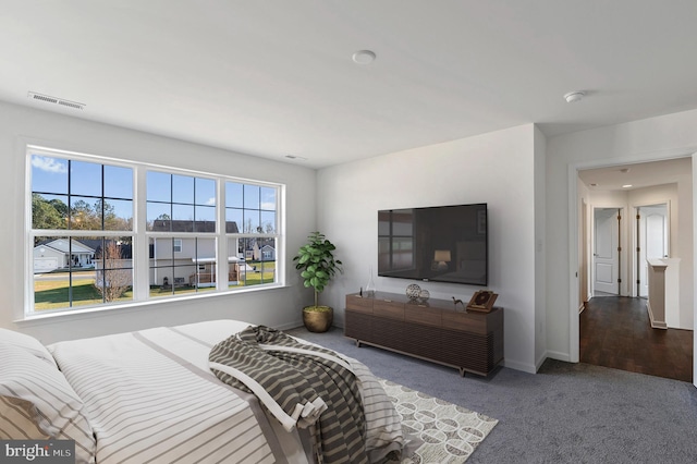 bedroom with dark carpet