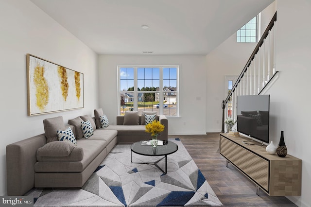 living room featuring dark wood-type flooring