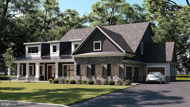 view of front of property featuring a porch, a front yard, and a garage