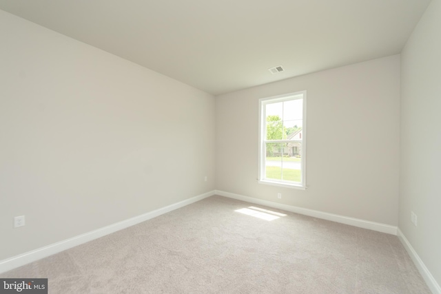 empty room with light colored carpet