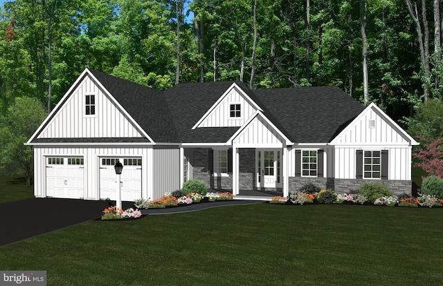 view of front facade with a porch, a garage, and a front lawn