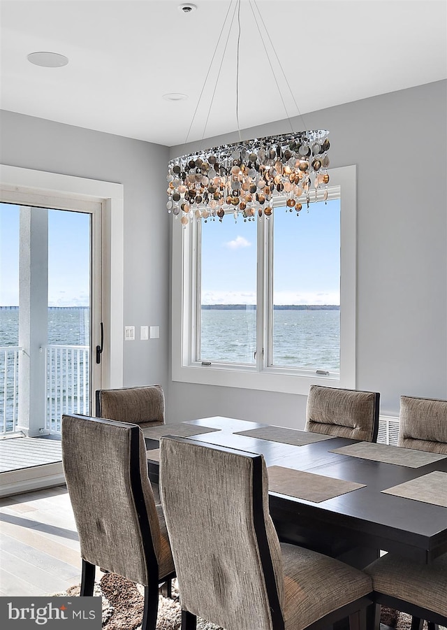 dining room with a water view