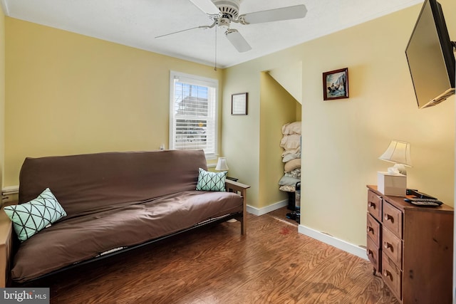 interior space with ceiling fan and wood-type flooring