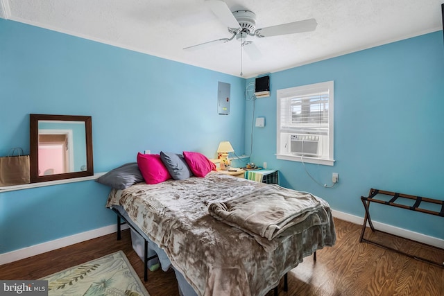 bedroom featuring ceiling fan, a textured ceiling, and dark hardwood / wood-style flooring