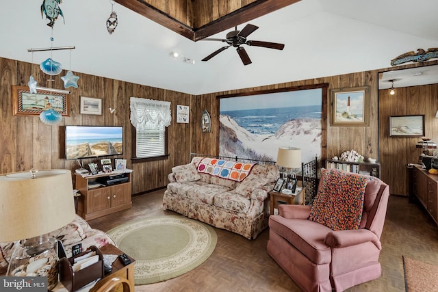 living room featuring dark parquet flooring, ceiling fan, and wood walls