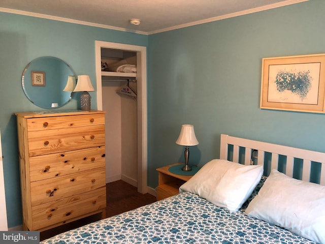 bedroom featuring dark hardwood / wood-style flooring, a closet, and ornamental molding