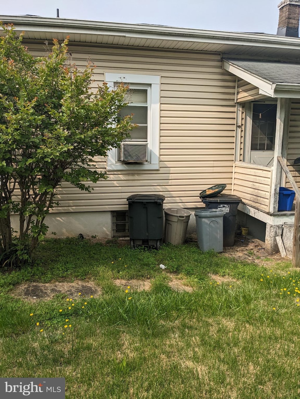 view of side of home featuring a lawn