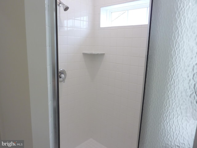 interior space with a tile shower