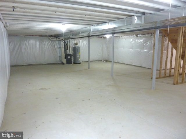 basement featuring heating utilities and water heater