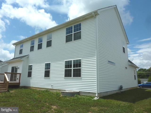 rear view of house with a lawn