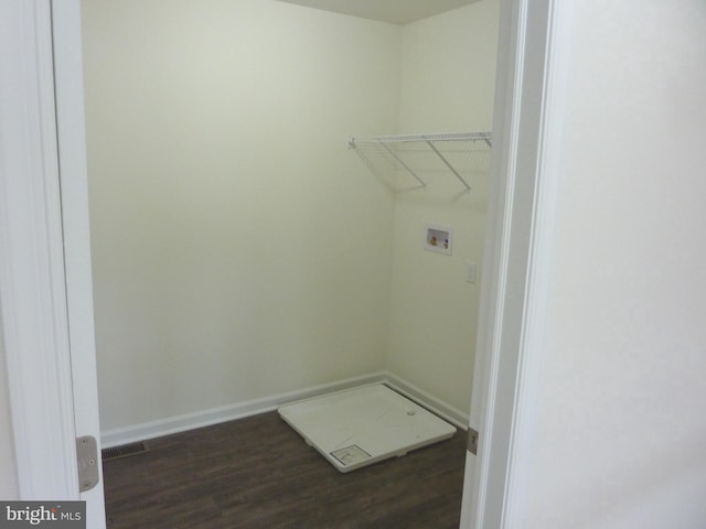 laundry room with dark wood-type flooring and hookup for a washing machine