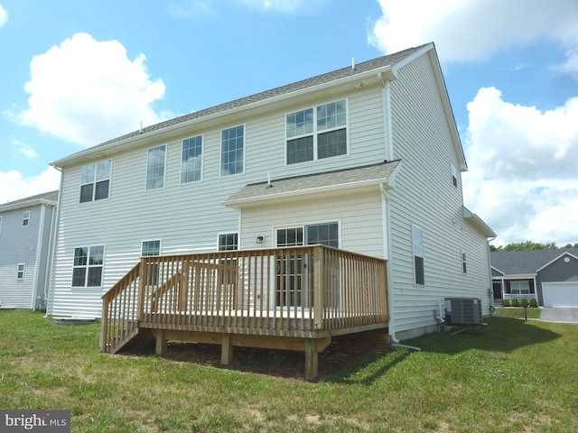 back of house featuring a deck, a yard, and central air condition unit