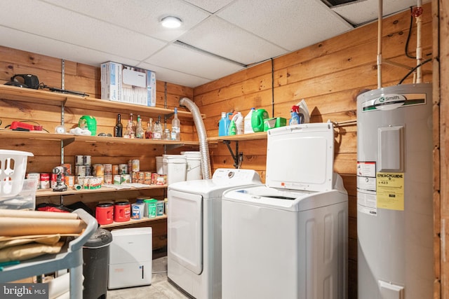 laundry area featuring water heater and washing machine and dryer