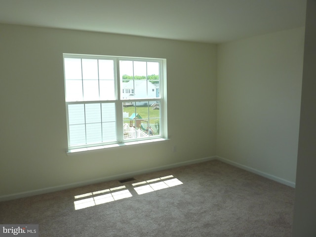 empty room featuring dark carpet