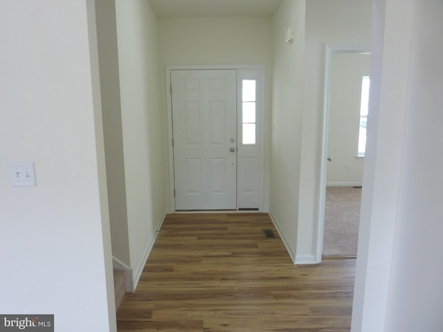 entryway with dark hardwood / wood-style floors