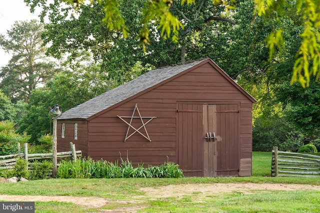 view of shed / structure featuring a yard