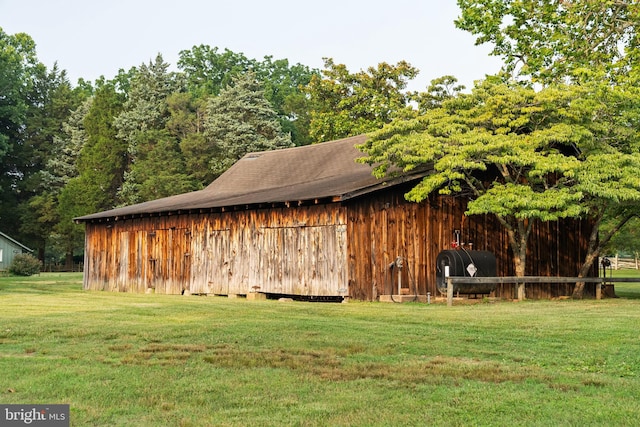 view of outdoor structure with a lawn