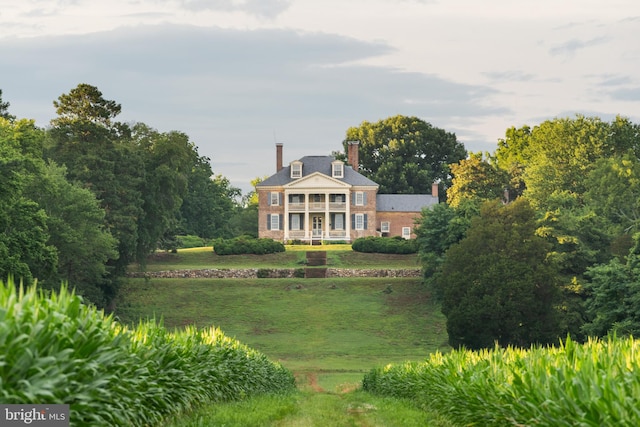 view of property's community with a yard