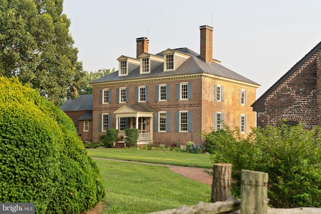 colonial home with a front yard