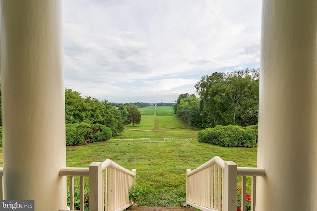 view of yard with a rural view