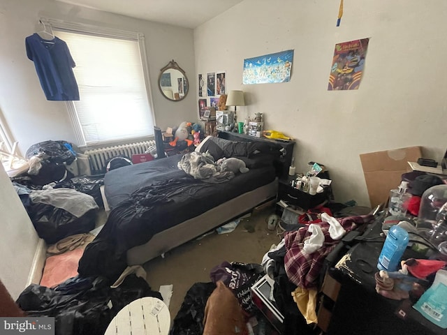 bedroom featuring radiator