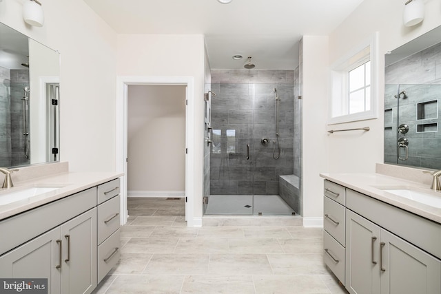 bathroom featuring walk in shower and vanity