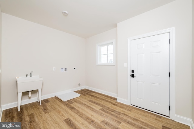 washroom featuring washer hookup, wood-type flooring, and electric dryer hookup