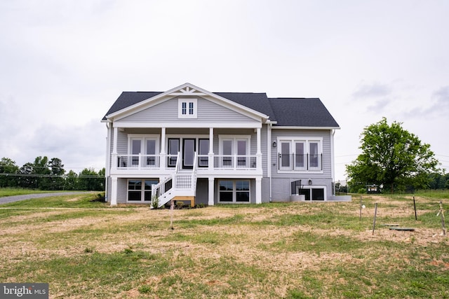 back of property with a lawn