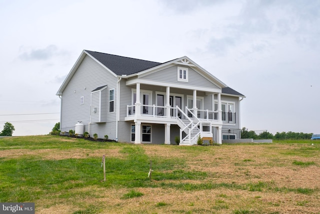 neoclassical / greek revival house with covered porch and a front yard