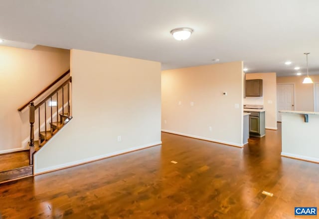 unfurnished living room featuring dark hardwood / wood-style flooring