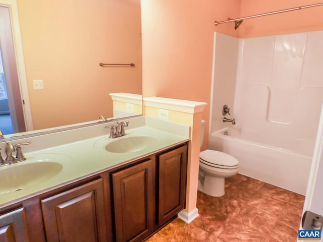 full bathroom featuring tile floors, dual sinks, bathtub / shower combination, toilet, and oversized vanity