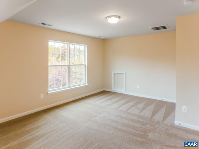 spare room with light carpet