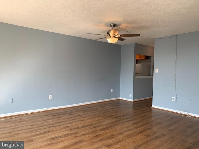 empty room with a textured ceiling, ceiling fan, and dark wood-type flooring