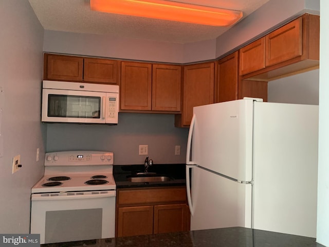 kitchen with sink and white appliances