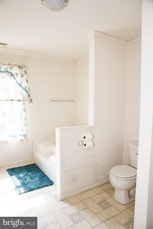 bathroom featuring toilet and tile floors