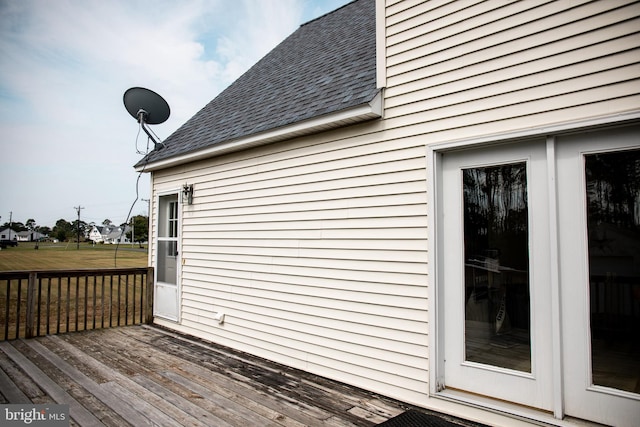 view of property exterior featuring a deck