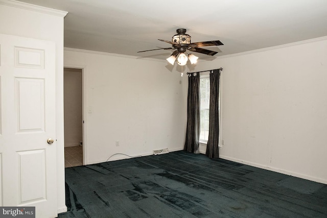 empty room with ceiling fan, crown molding, and dark carpet