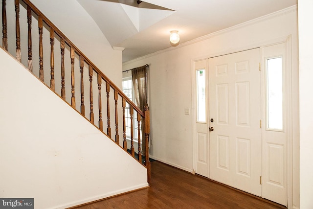 foyer entrance featuring dark hardwood / wood-style flooring and ornamental molding