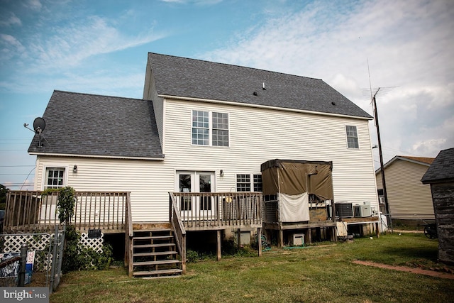 rear view of property featuring a deck, a pergola, and a yard