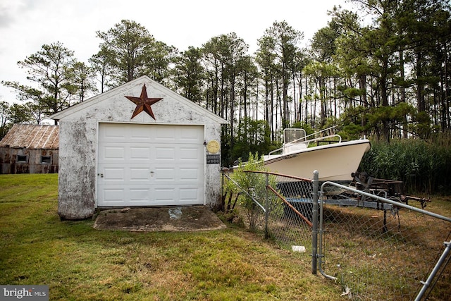 garage with a yard